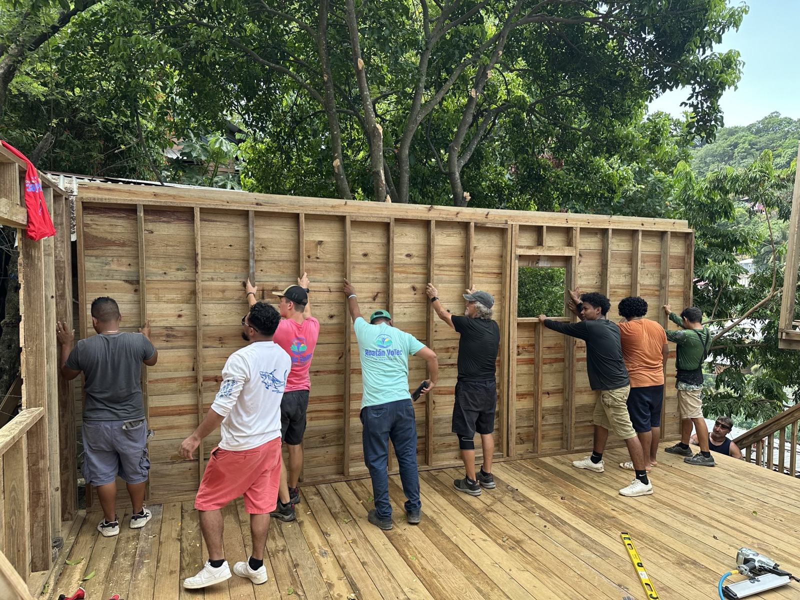 Volunteers raising a wall at the September 2026 build
