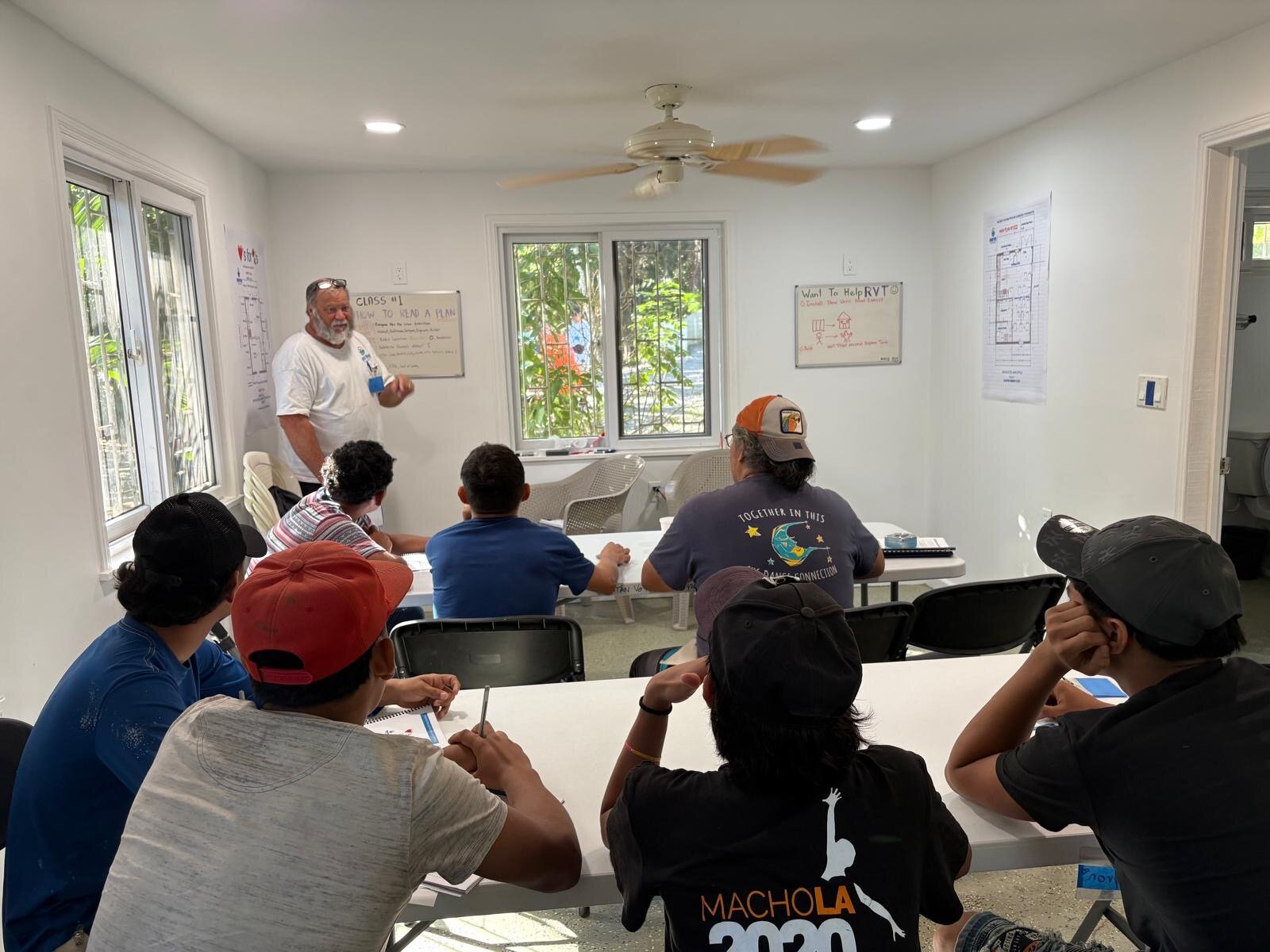 Instructor teaching RVT students at whiteboard — Class 1: How to Read a Plan — Sandy Bay campus